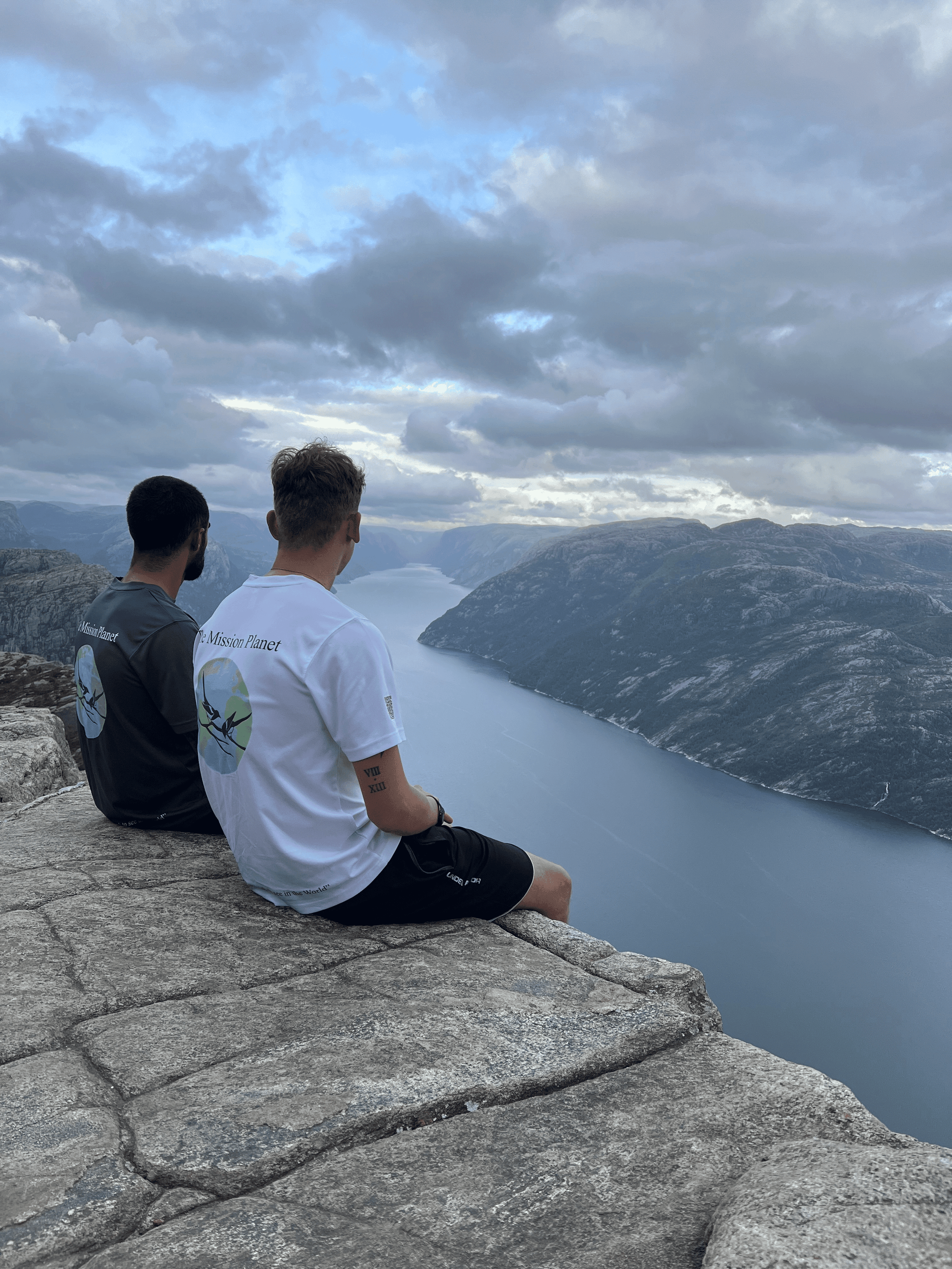 Rohan and Tom overlooking a fjord during a Mission Planet endurance journey through remote landscapes