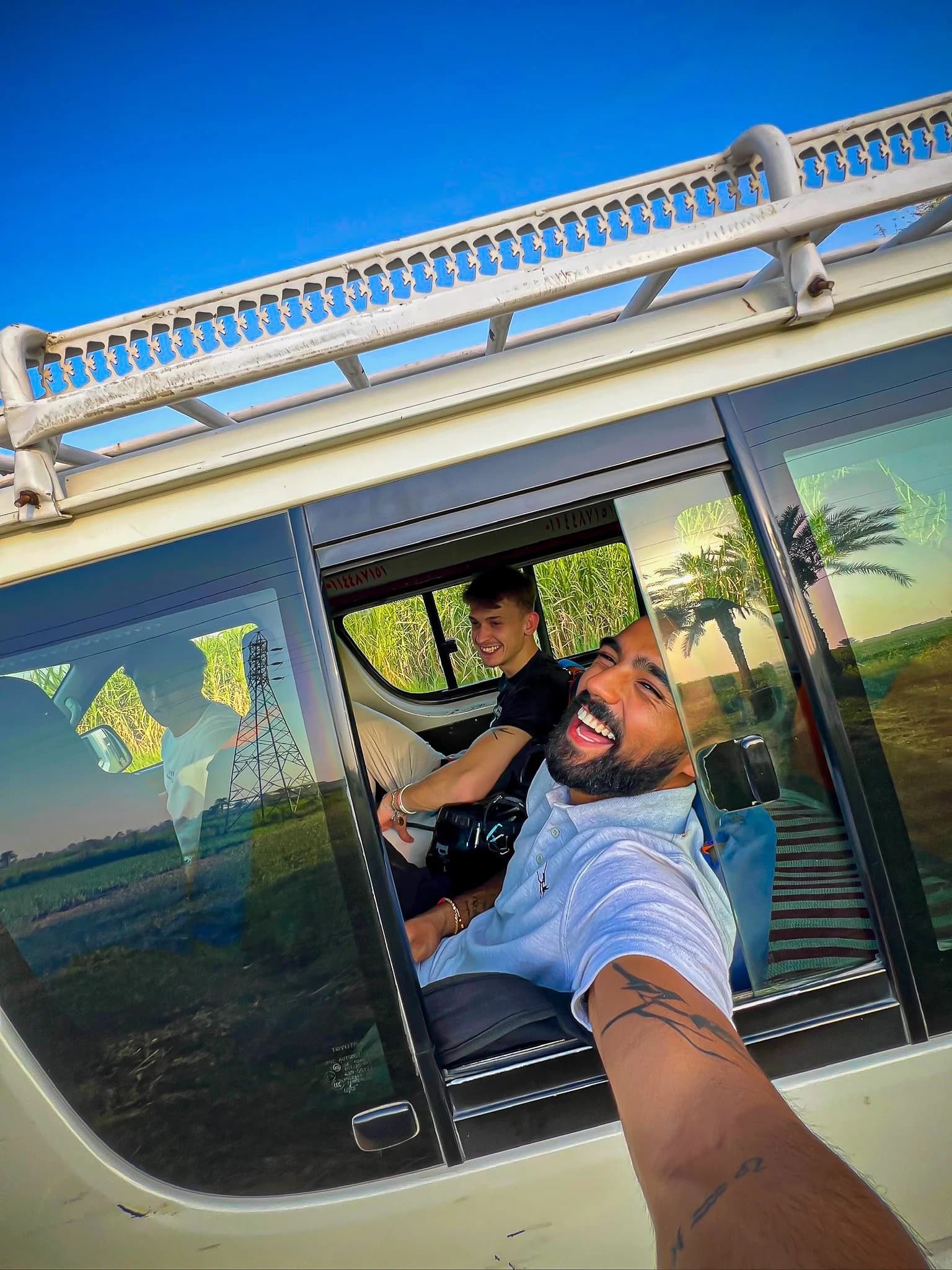 Rohan and Tom travelling through rural landscapes during a Mission Planet journey supporting animal welfare work