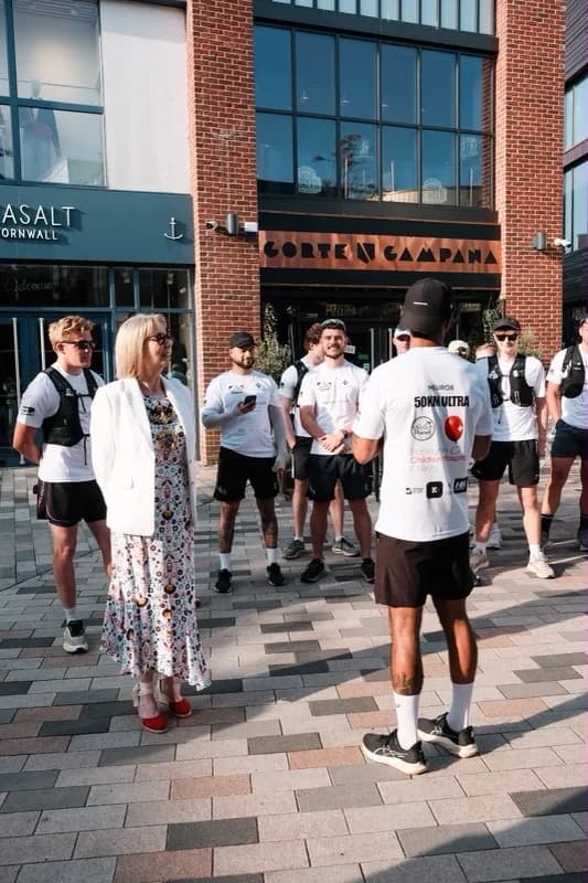 A group gathered outside in the town centre