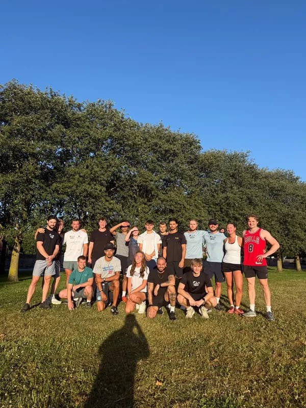 A large group together under a tree