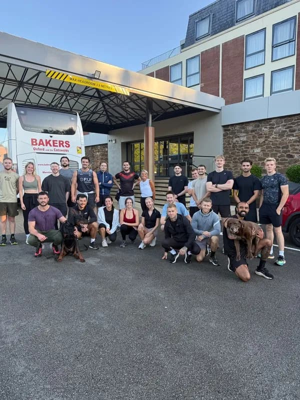 A group outdoors after a session, with a dog