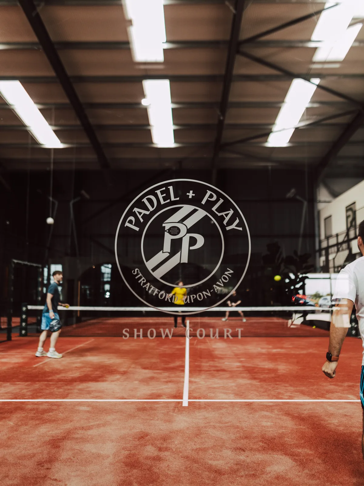 A rally in progress on the courts at Padel & Play